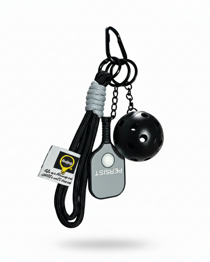 Clean product photo of black and grey pickleball keychain on white background