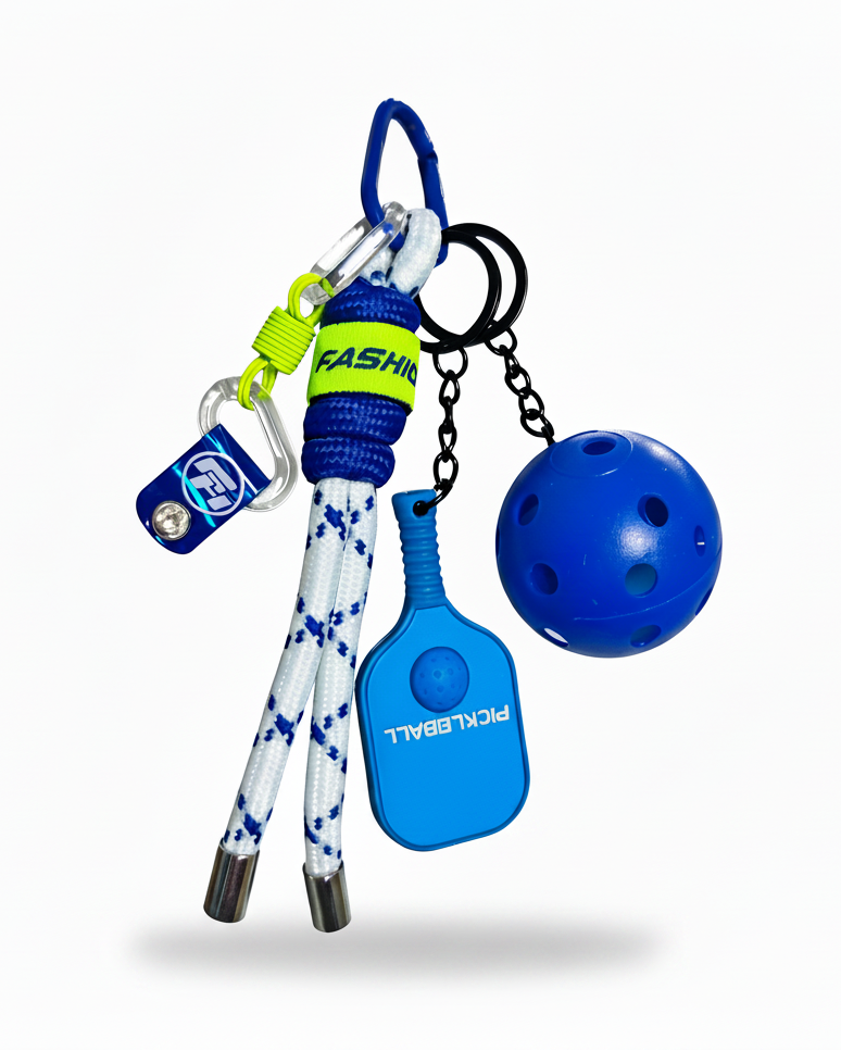 Clean product photo of blue pickleball keychain on white background