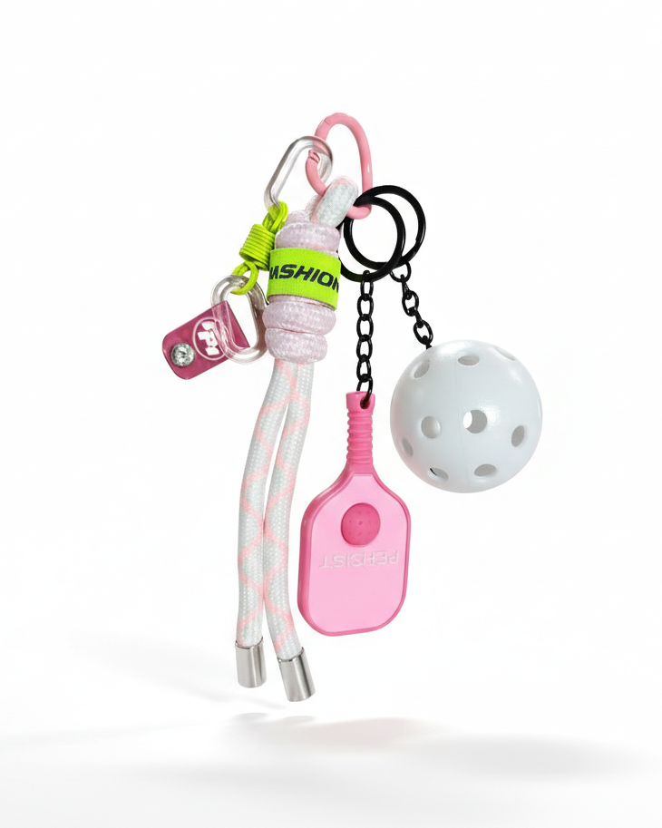 Clean product photo of pink pickleball keychain on white background